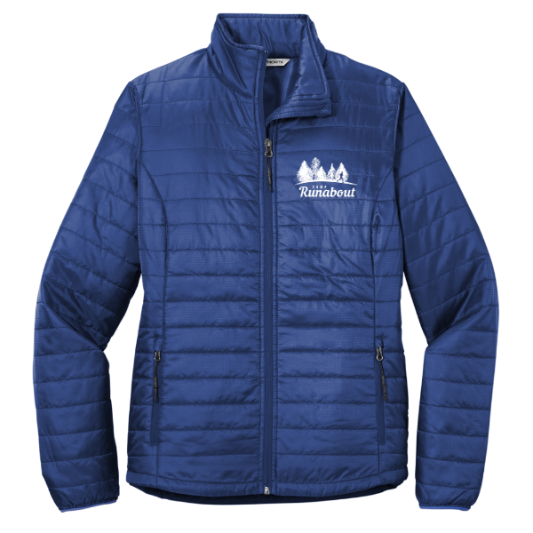 Women’s royal blue Camp Runabout Packable Puffy Jacket with embroidered white logo featuring pine trees and runner silhouette on chest.